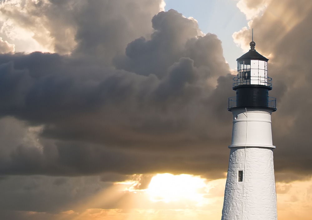 A lighthouse serves as a beacon of hope in a storm