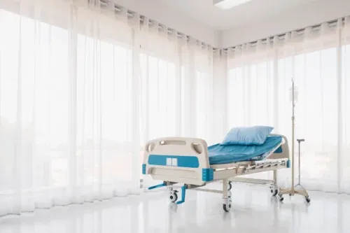 Hospital,Bed,With,Pillow,And,Blanket,And,Intravenous,(iv),Stand,