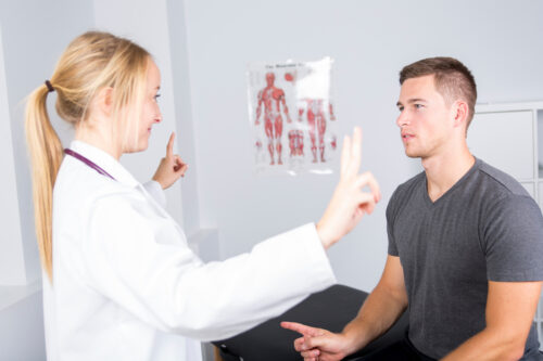Doctor examining her patient in medical office